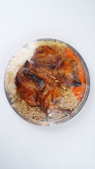 Picture of Chicken on a tray of mixed rice with 1 marag